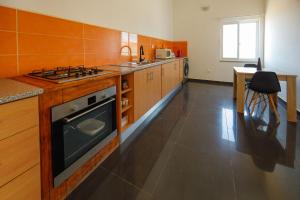 Kuchyň nebo kuchyňský kout v ubytování Chambre 3 Residencial Eunice