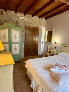 Postel nebo postele na pokoji v ubytování Relais Il Monaco