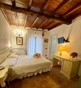 Postel nebo postele na pokoji v ubytování Relais Il Monaco