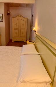Postel nebo postele na pokoji v ubytování Relais Il Monaco