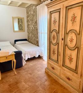 Postel nebo postele na pokoji v ubytování Relais Il Monaco