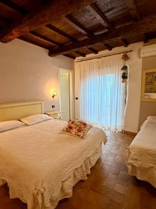 Postel nebo postele na pokoji v ubytování Relais Il Monaco