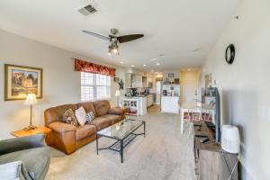 a living room with a couch and a table at 3 Mi to Branson Landing Condo with Pool Access in Branson
