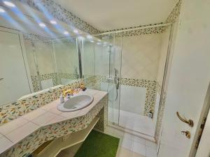 a bathroom with a sink and a shower at Casa al Castello in Lerici +14 photos