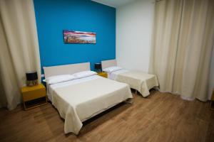 Postel nebo postele na pokoji v ubytování Terminal 1 Guest House