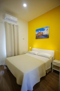 Postel nebo postele na pokoji v ubytování Terminal 1 Guest House