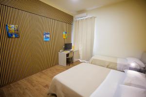 Postel nebo postele na pokoji v ubytování Terminal 1 Guest House
