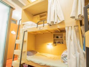 Voodi või voodid majutusasutuse Yiweidu Youth Apartment toas