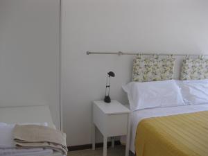 Postel nebo postele na pokoji v ubytování Country House-B&B-Appartamenti Ai Cipressi