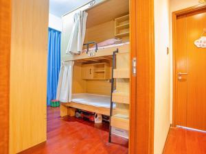 Voodi või voodid majutusasutuse Yiweidu Youth Apartment toas