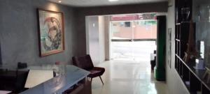 an office with a desk and a chair and a window at Nalu Beach Hotel pousada in Fortaleza