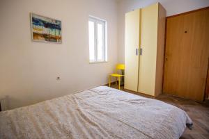 Ein Bett oder Betten in einem Zimmer der Unterkunft Anchi Guesthouse