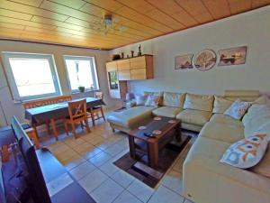 a living room with a couch and a table at gemütliche Ferienwohnung in ruhiger Lage, Nähe Luxemburg und Trier - Holiday and Nature Olk in Ralingen