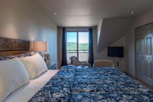 Ένα ή περισσότερα κρεβάτια σε δωμάτιο στο Tremblant Prestige - Clairiere 404