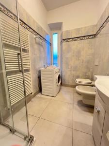 a bathroom with a shower and a toilet and a sink at Vicino al mare sulla pista ciclabile in Imperia +71 photos