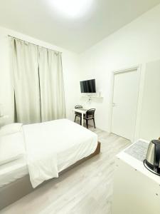 Postel nebo postele na pokoji v ubytování The house Of Brindisi