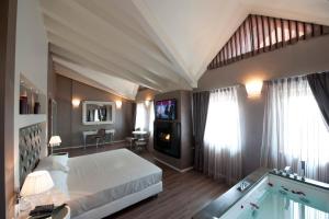 Postel nebo postele na pokoji v ubytování Hotel Morgana