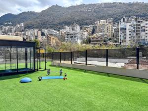 a view of a city from the roof of a house at Apartment in Jounieh - J707 in Al Bāţiyah