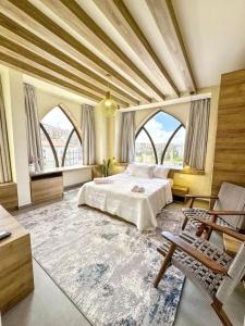 a large bedroom with a large bed and windows at Apartment in Jounieh - J707 in Al Bāţiyah
