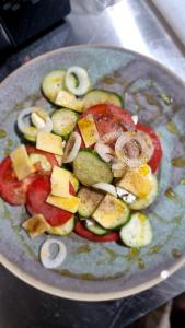 a plate of vegetables on top of a table at Apple Hotel in Yerevan +31 photos