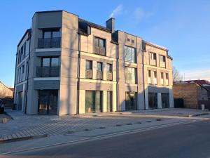 a building on the side of a street at MC Apartamenty Ściegiennego 3 in Augustów