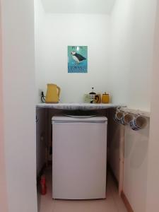 a small kitchen with a counter and a sink at The Croft in Whale Islet