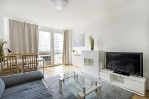 Televízia a/alebo spoločenská miestnosť v ubytovaní Śliska Residence