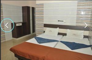 Postel nebo postele na pokoji v ubytování Hotel mim Grand