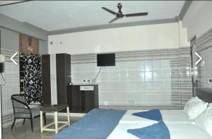 Postel nebo postele na pokoji v ubytování Hotel mim Grand