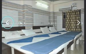 Postel nebo postele na pokoji v ubytování Hotel mim Grand