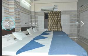 Postel nebo postele na pokoji v ubytování Hotel mim Grand