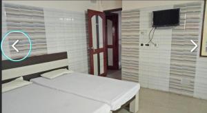 Postel nebo postele na pokoji v ubytování Hotel mim Grand