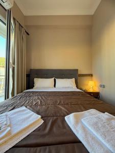 Postel nebo postele na pokoji v ubytování Hotel Koutriaris + 6 fotografií