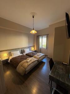 Postel nebo postele na pokoji v ubytování Hotel Koutriaris