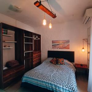 Postel nebo postele na pokoji v ubytování Casa Amor Turquesa