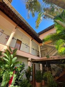 a building with a bunch of plants in front of it at Hotel Charme Fonte do Boi in Salvador +52 photos