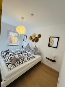 Katil atau katil-katil dalam bilik di Casa del Mar - Ferienwohnung Norddeich +13 gambar