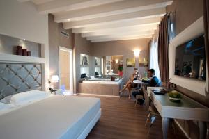 Postel nebo postele na pokoji v ubytování Hotel Morgana