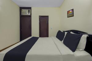 Voodi või voodid majutusasutuse Hotel O Malhotra BnB toas