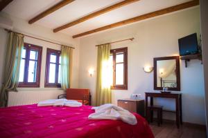 Postel nebo postele na pokoji v ubytování Kallisto Guesthouse