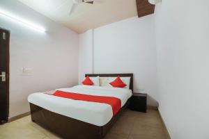 Postel nebo postele na pokoji v ubytování Hotel O Iris Lite