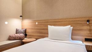 a hotel room with a bed and a couch at Hotel Bankir Khiva in Khiva