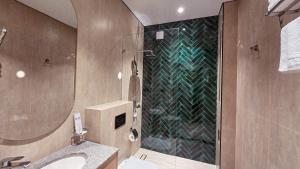 a bathroom with a shower and a sink at Hotel Bankir Khiva in Khiva +37 photos