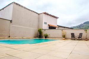 Swimmingpoolen hos eller tæt på Ap 1 Pico do Itacolomy piscina aquecimento solar e churrasqueira + 12 billeder