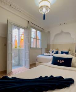 Postel nebo postele na pokoji v ubytování Riad Magnolia&SPA