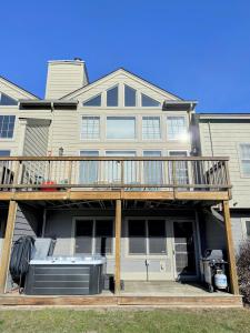 a large house with a deck and a heater at SH5 Luxurious Stone Hill Townhome in Carroll