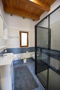 a bathroom with a sink and a shower at Villa MonteLago in Široka +23 photos