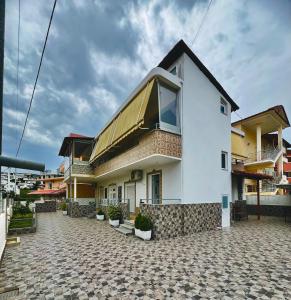 a white house with a window on top of it at Villa Bella in Ksamil