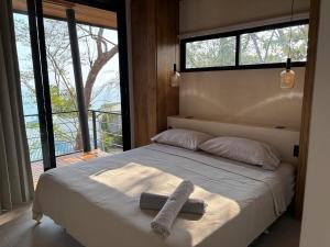 Voodi või voodid majutusasutuse Mar a Cielo Brand New Ocean View Retreat toas