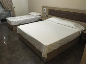 Postel nebo postele na pokoji v ubytování Herges Hotel